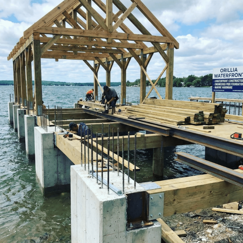 Boathouse and dock construction in Orillia showing reinforced pier foundation, structural framing, and marine-grade hardware for waterfront durability near Lake Simcoe.